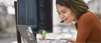 A woman looking at a computer screen.